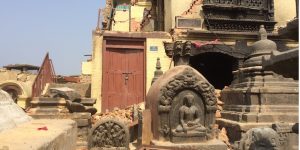 Figure 1. Damage to buildings within the Swayambhu Temple complex, known colloquially as the Monkey Temple. Damage at the site may have been exacerbated by amplification of seismic waves (topographic amplification) associated with the small hill on which the complex was built (Sánchez-Sesma, 1993). The top of the hill is about 75 meters above the adjacent valley. Credit: Susan Hough, U.S. Geological Survey, public domain